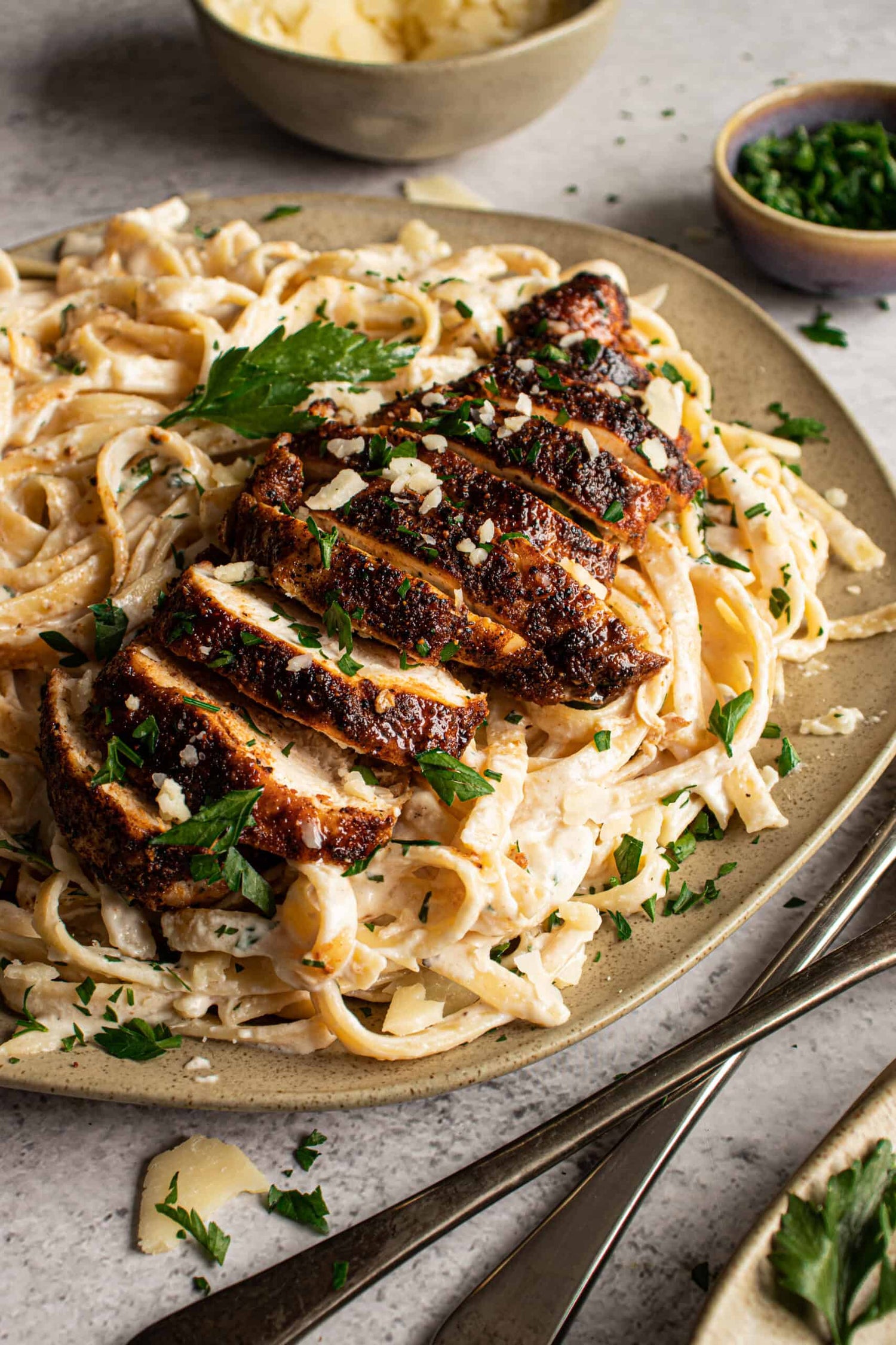 Blackened Chicken Alfredo with a creamy roasted garlic sauce. 