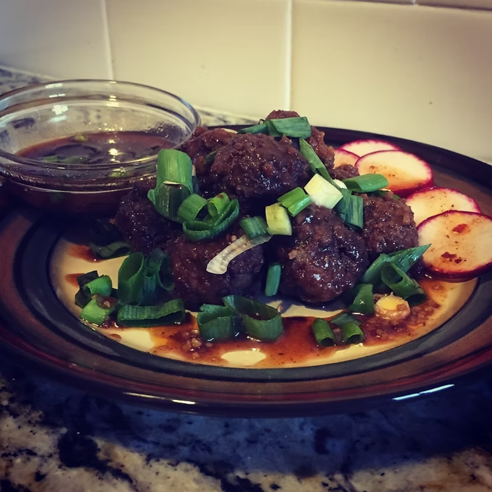 Drunken Bourbon Meatballs with Raspberry & Mango - A perfect dish for potlucks